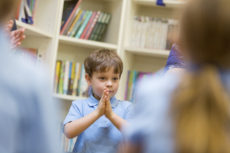 Boy praying or hands clasped