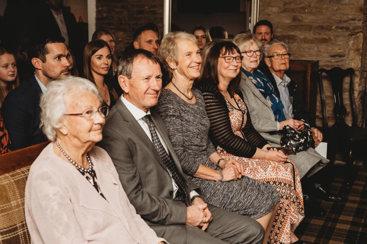 A group of older relatives at a naming ceremony