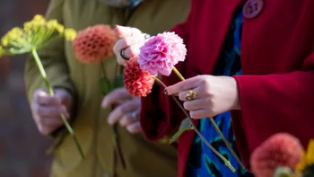 Holding flowers at a funeral